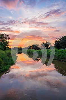 Sunrise reflection in a canal