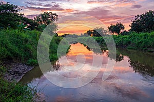 Sunrise reflection in a canal