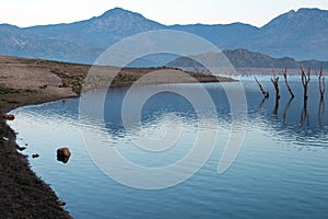 Sunrise reflections on drought stricken Lake Isabella in the southern Sierra Nevada mountains of California