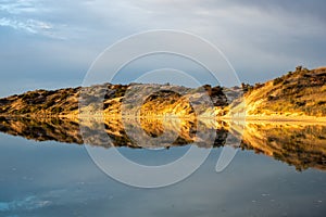 Sunrise reflections on the Onkaparinga River in Port Noarlunga South Australia on 25th November 2019