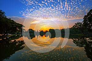 Sunrise and reflections at Sukhothai Historical Park.