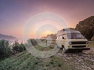 sunrise on the river waking up relaxed in a camper van