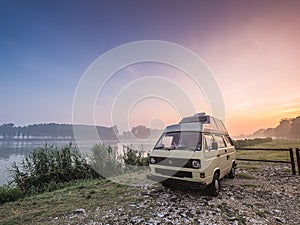 sunrise on the river waking up relaxed in a camper van