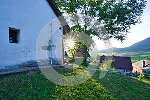 Sunrise by Saint Martin's Church in Martincek during summer