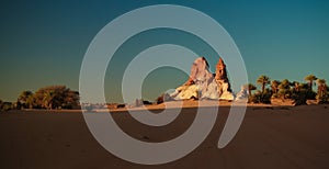 Sunrise at sandstone formation in the Sahara desert near Yoa Lake group of Ounianga Kebir, Ennedi, Chad photo