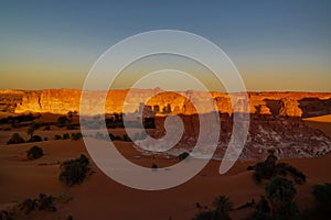 Sunrise at sandstone formation in the Sahara desert near Yoa Lake group of Ounianga Kebir, Ennedi, Chad