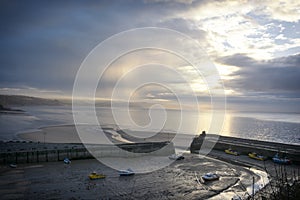 Sunrise Saunderfoot Harbour and beach South Wales Pembrokeshire