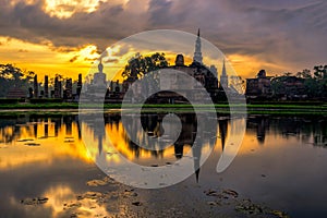 Sunrise scence of Wat Mahathat temple in the Sukhothai Historical Park contains the ruins of old Sukhothai, Thailand, UNESCO