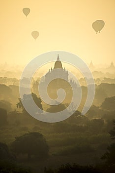 Sunrise scene hot air balloons fly over pagoda ancient city field in Bagan Myanmar.High image quality