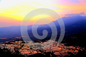 The Sunrise scenery of Yuenyang Hani Terrace in Yunnan , China