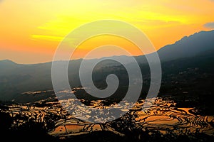 The Sunrise scenery of Yuenyang Hani Terrace in Yunnan , China