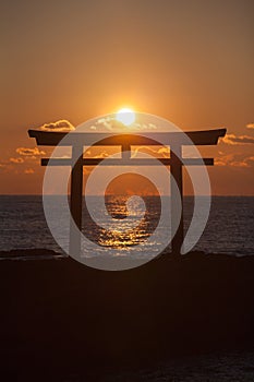 Sunrise and sea at Japanese shinto gate