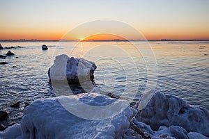 Sunrise by the sea in winter