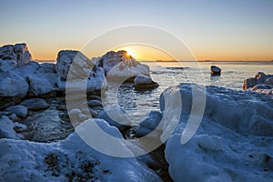 Sunrise by the sea in winter