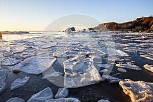 Sunrise by the sea in winter