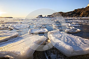 Sunrise by the sea in winter