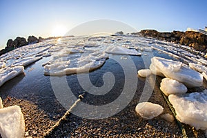 Sunrise by the sea in winter