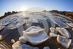 Sunrise by the sea in winter