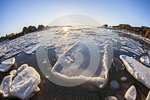 Sunrise by the sea in winter