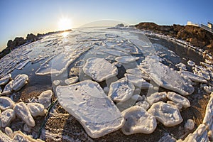 Sunrise by the sea in winter