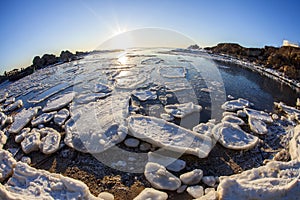 Sunrise by the sea in winter