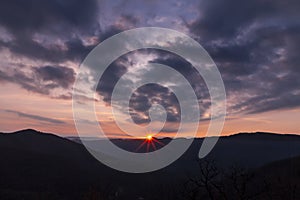 Sunrise seen from the Sanctuary of the Beata Vergine di Castelmonte. View on the mountains of Slovenia.