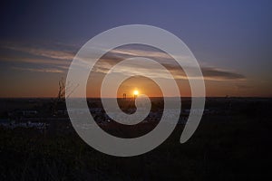 Sunrise in Seville: An impressive sunrise over the bridge of the fifth centenary, landscape of the silhouette of Seville photo