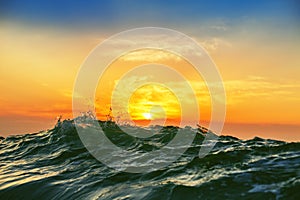 Sunrise and shining waves in ocean