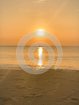 Sunrise with Ship Sailing in Sea