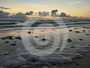 Sunrise on the shores of the atlantic ocean with waves and sea foam. Cayo Coco, Cuba