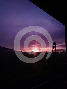 Sunrise silhouette of a moving train