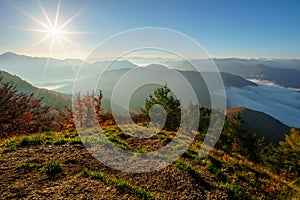 Sunrise from Sip mountain during autumn with inversion mist in the valley