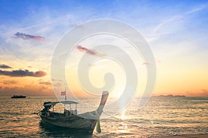 Sunrise sky background concept: Traditional Thai long tail boat at beautiful sunrise background