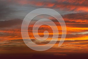 Sunrise sky with red color fire on a cloudy winter day. Space for text