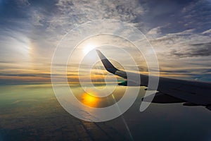 Sunrise sky view from airplane window. Air travel and transportation concept