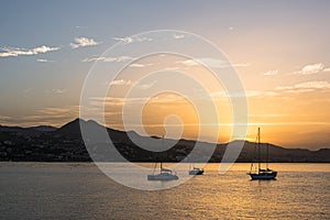Sunrise with small sail boats on the Mediterranean
