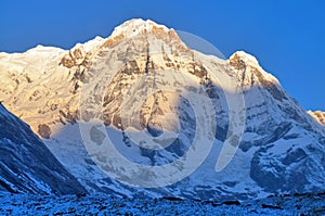 Sunrise in Snowy Mountain Landscape in Himalaya. Annapurna South peak, Annapurna Base Camp Track.