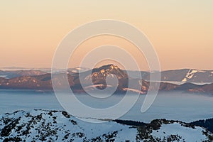 Sunrise in snowy mountains and fog, Slovakia Low Tatras