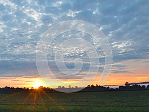 Sunrise star glow morning over crop fields in FingerLakes