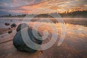 Sunrise, stones in water