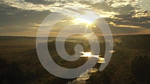 Sunrise on a summer blurred meadow. Drone view.