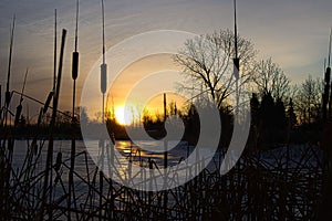 Sunrise sun reflection on frozen lake