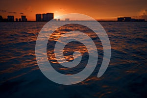 Sunrise or sunrise overlooking the sea and a line of hotels in Cancun