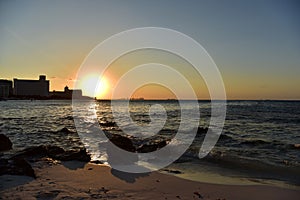 Sunrise or sunrise overlooking the sea and a line of hotels in Cancun