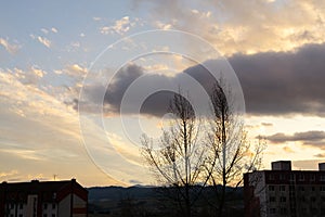 Sunrise or sunset over the hills and meadow.