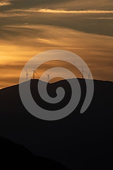 Sunrise, sunset over mountains silhouette background. Vertical photo