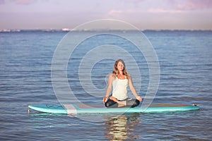 Sunrise SUP Yoga practice in Waikiki meditation photo