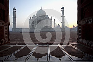 Sunrise Taj Mahal seen through an entrance