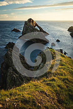 Sunrise time by the Bow Fiddle Rock in Scotland