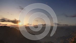 Sunrise Time Lapse over Mountains Peaks, camera panning, stock footage